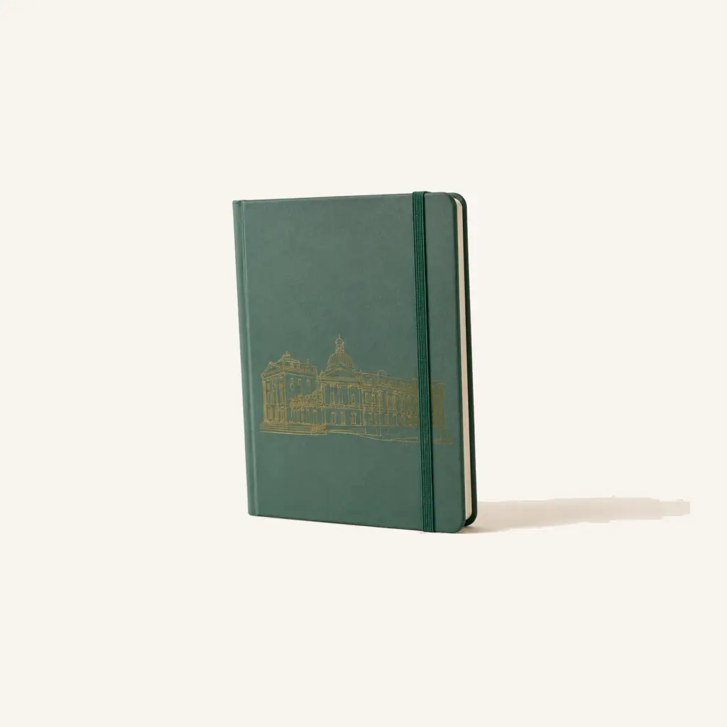 Sage green stationery notebook with a gold landmark illustration